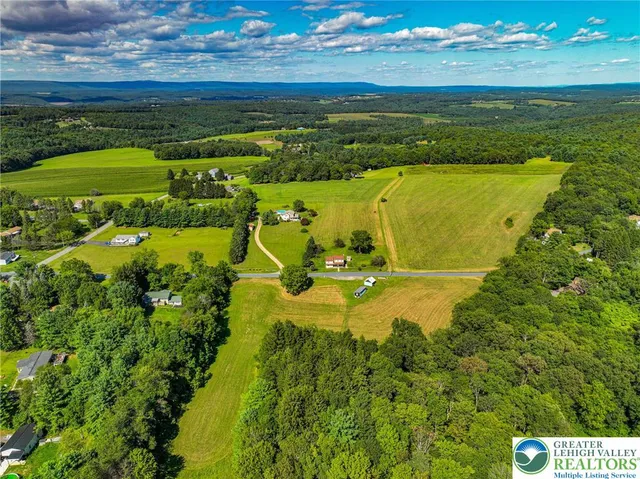 a view of an ocean and a houses