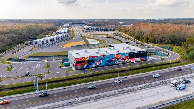 a view of swimming pool with outdoor seating and city view