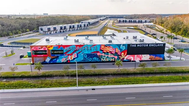 an aerial view of residential house with outdoor space and swimming pool