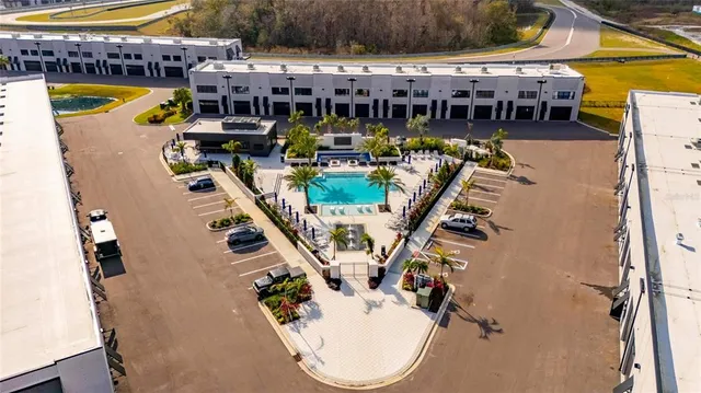 an aerial view of a house with swimming pool