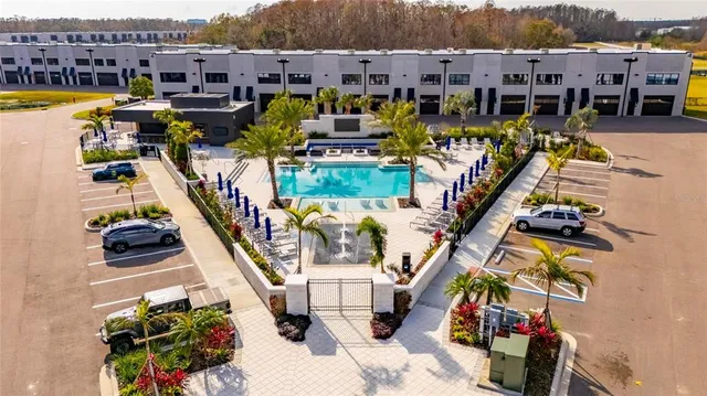 a room with table and chairs potted plants