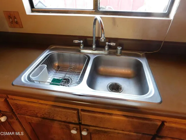 a bathroom with a sink and mirror