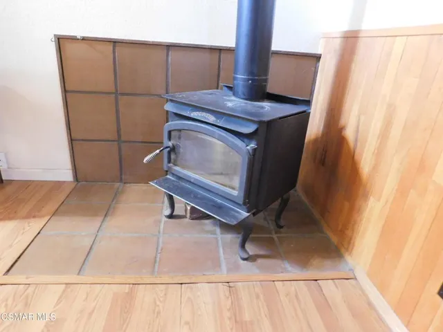 a view of a kitchen with an entryway and wooden floor