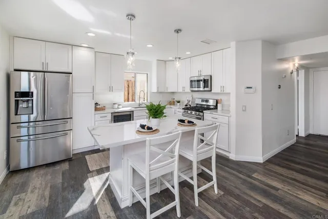 a bedroom with a bed and a potted plant