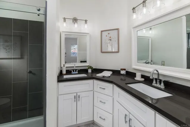 a view of a room with wooden floor and windows