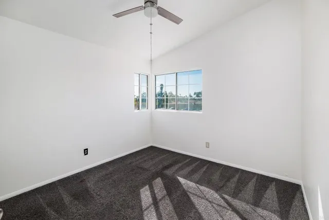 a bathroom with a toilet a sink and a mirror