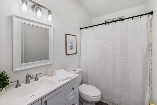 an empty room with a empty space and a ceiling fan