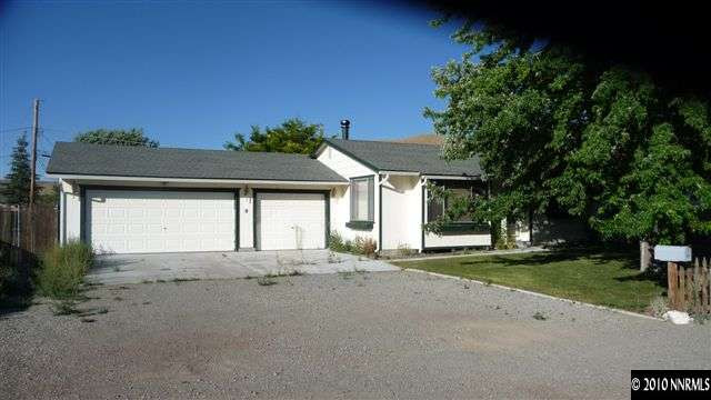 3455 Canvasback Lane Reno, NV 89508 - Photo 1 of 9 a front view of a house with a yard and garage