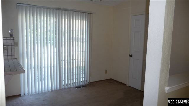 3455 Canvasback Lane Reno, NV 89508 - Photo 4 of 9 a view of a livingroom with an empty space and a window