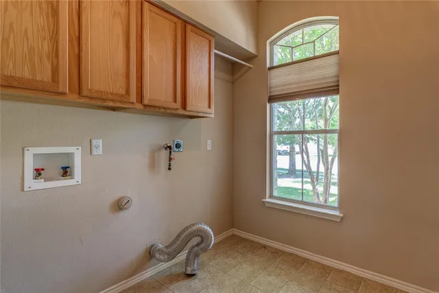 a bathroom with a sink and cabinets