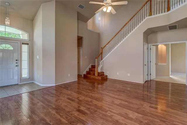 wooden floor and an entryway in a hall with an entryway