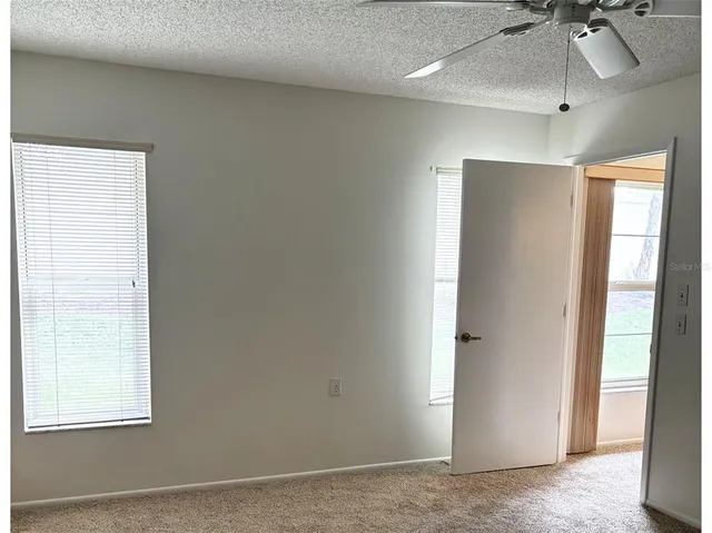 a bathroom with a sink toilet and a mirror