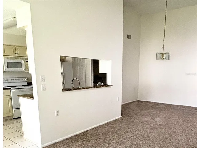 a view of a kitchen with wooden floor