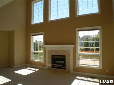 860 Benner Road Allentown, PA 18104 - Photo 7 of 29 three story family room with gas fireplace and pas