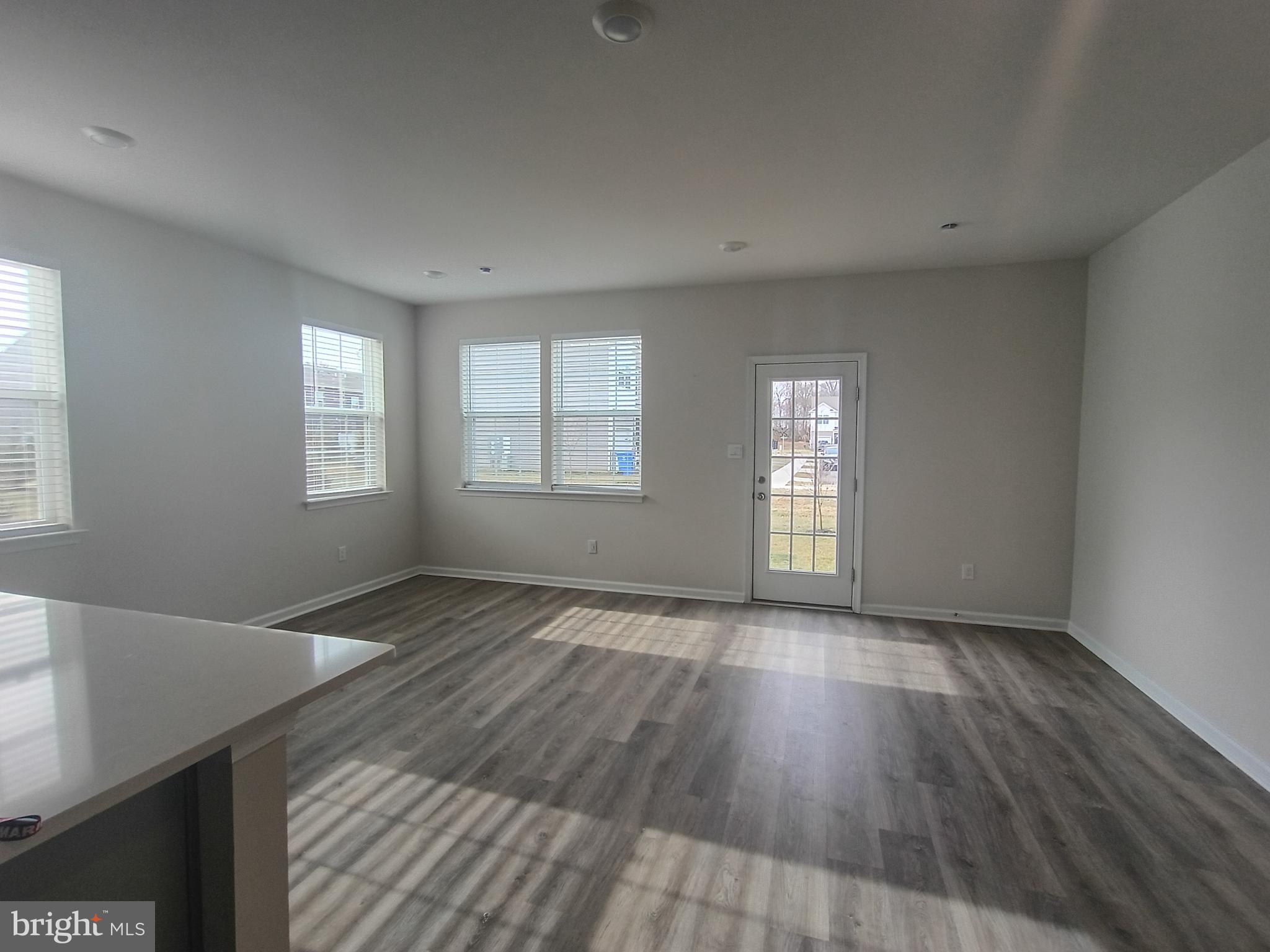 25 Elliot Lane Westampton, NJ 08060 - Photo 6 of 14 a view of an empty room with wooden floor and window