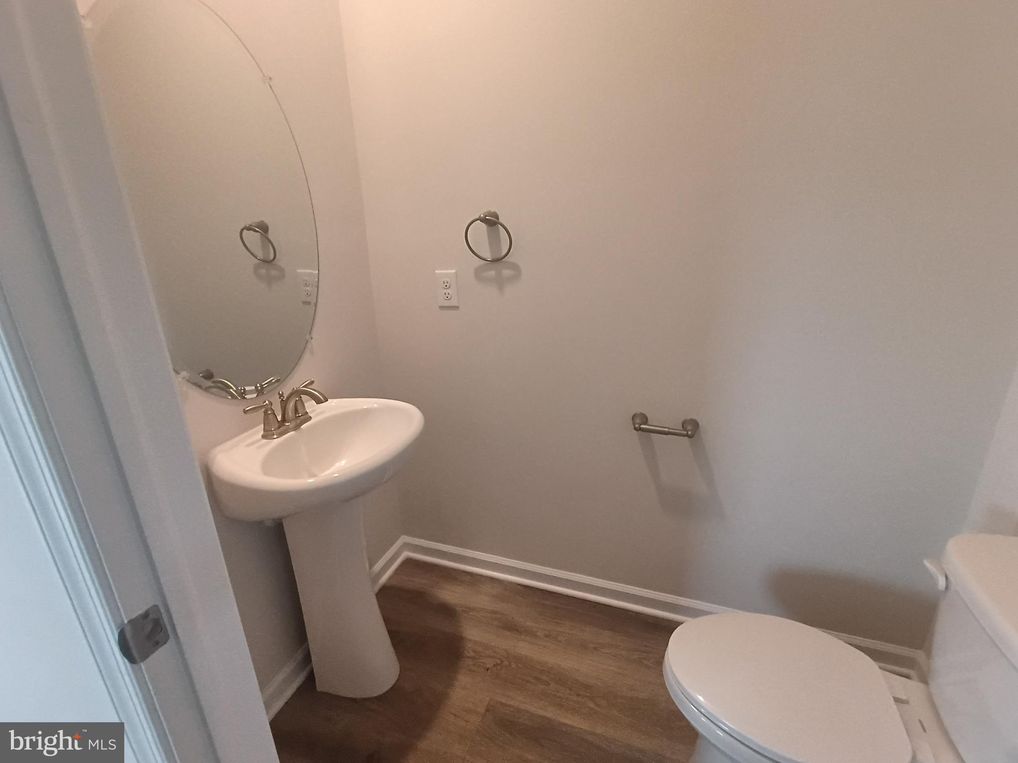 25 Elliot Lane Westampton, NJ 08060 - Photo 7 of 14 a bathroom with a sink a toilet and a mirror