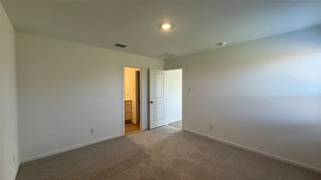 an empty room with closet area