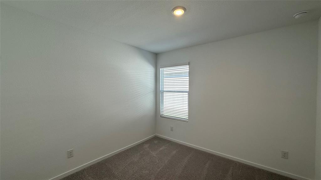 7701 Rutherford Lane McKinney, TX 75069 - Photo 12 of 20 an empty room with windows