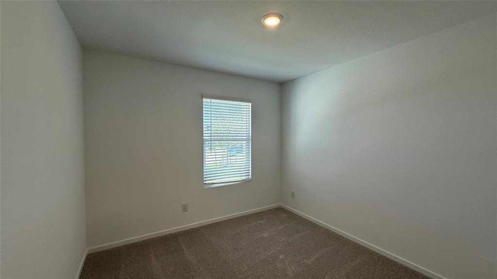 7701 Rutherford Lane McKinney, TX 75069 - Photo 14 of 20 an empty room with a window