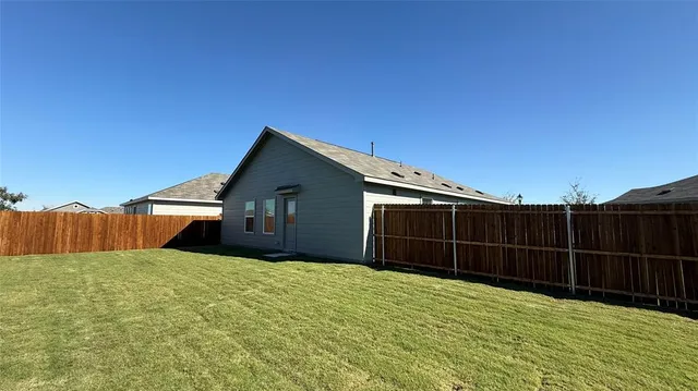 a house view with a backyard space