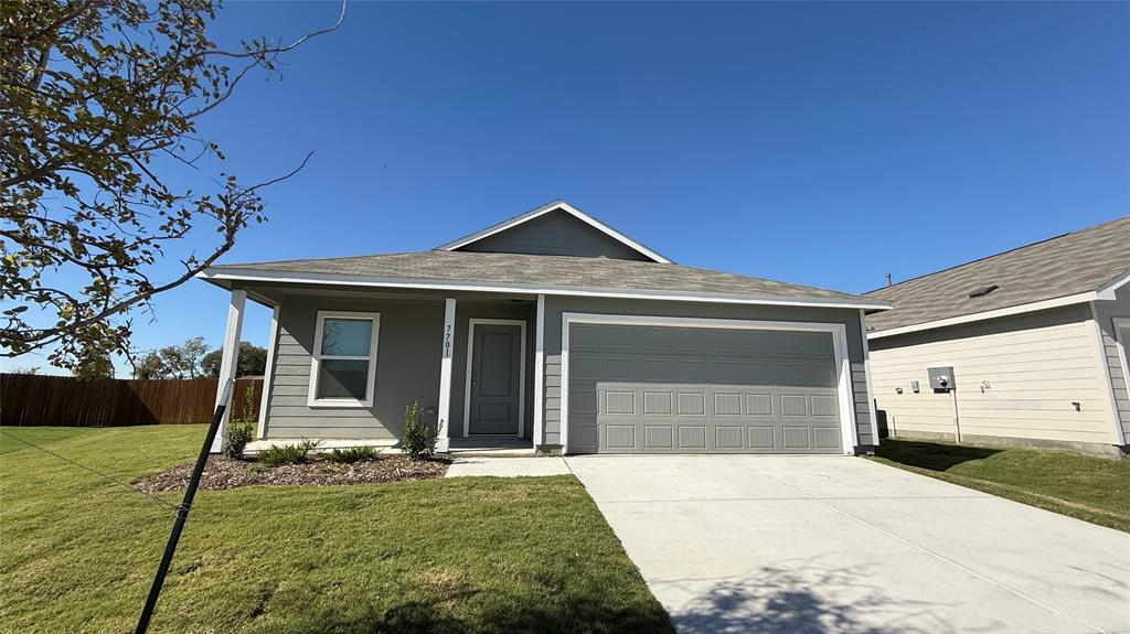 7701 Rutherford Lane McKinney, TX 75069 - Photo 3 of 20 a front view of a house with a yard