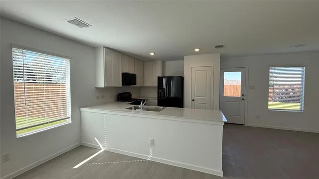 an empty room with windows