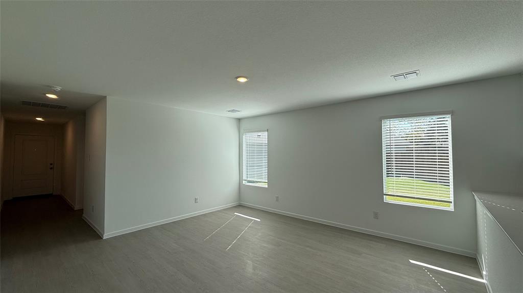 7701 Rutherford Lane McKinney, TX 75069 - Photo 7 of 20 an empty room with windows