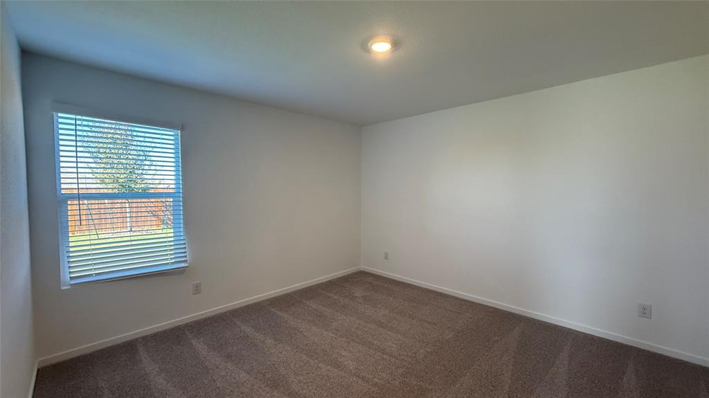 7701 Rutherford Lane McKinney, TX 75069 - Photo 10 of 20 an empty room with a window