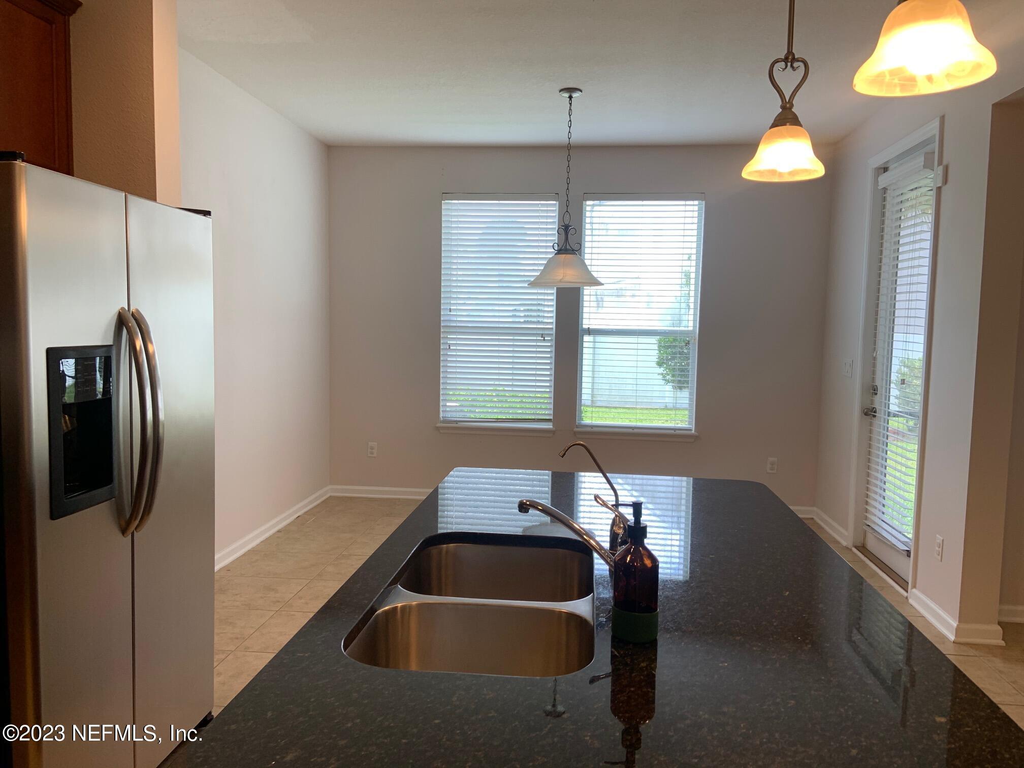 3863 Chasing Falls Road Orange Park, FL 32065 - Photo 10 of 32 a room with window and chandelier