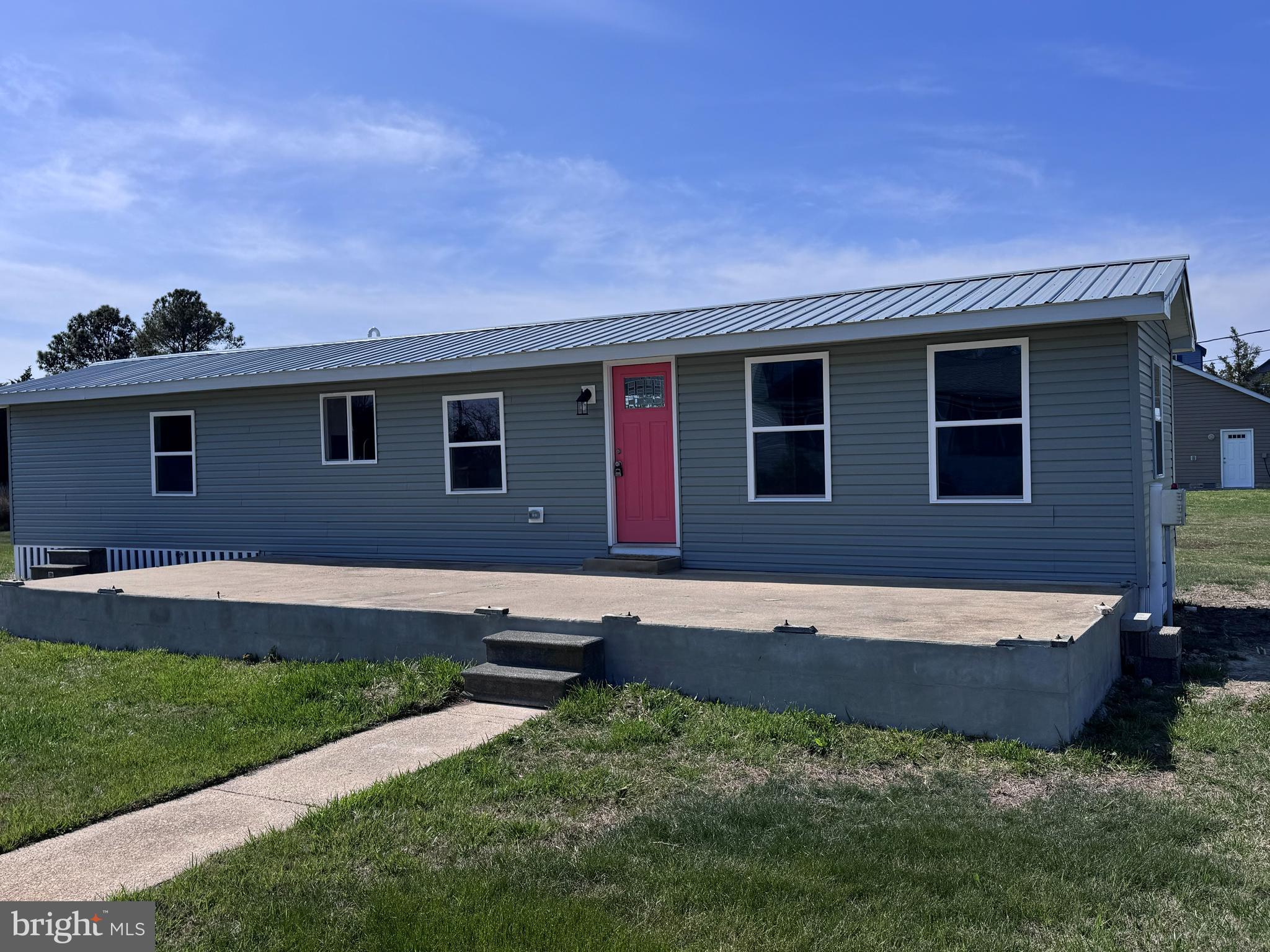 a view of backyard with seating space