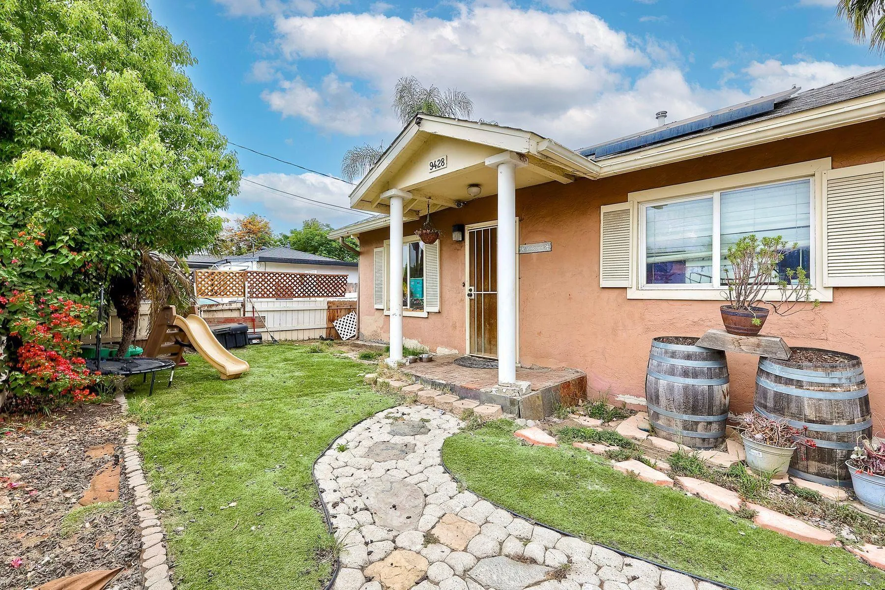 9428 Prospect Avenue Santee, CA 92071 - Photo 1 of 23 a front view of a house with garden
