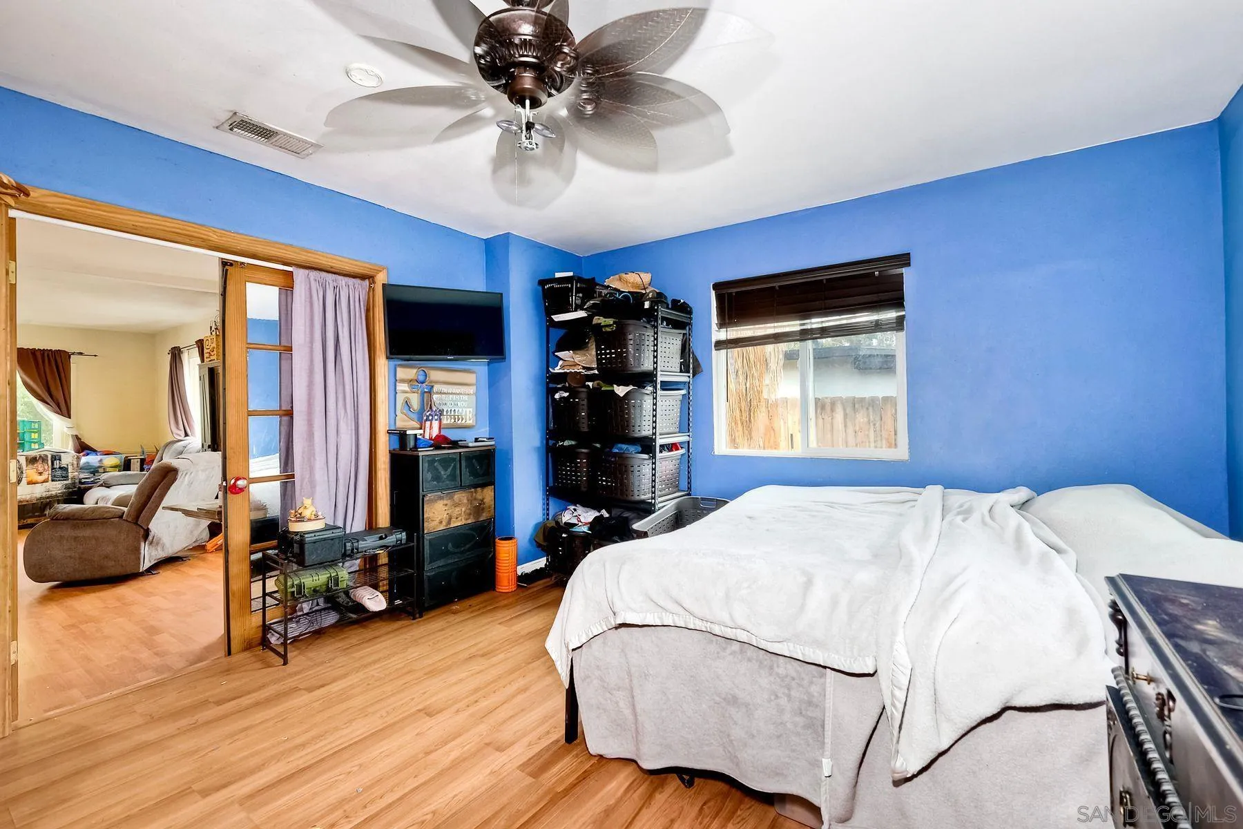 9428 Prospect Avenue Santee, CA 92071 - Photo 12 of 23 a bed sitting in a spacious bedroom next to a window