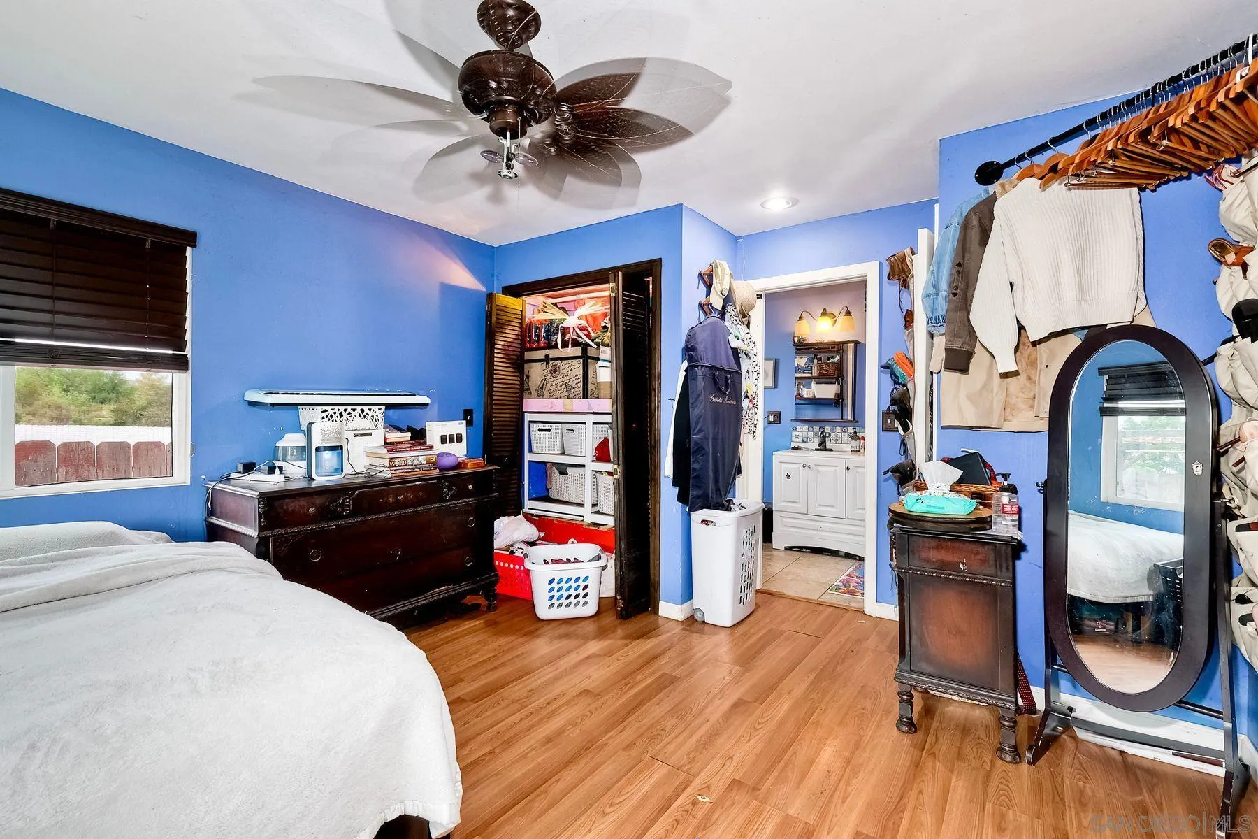 9428 Prospect Avenue Santee, CA 92071 - Photo 13 of 23 a bedroom with furniture and a wooden floor