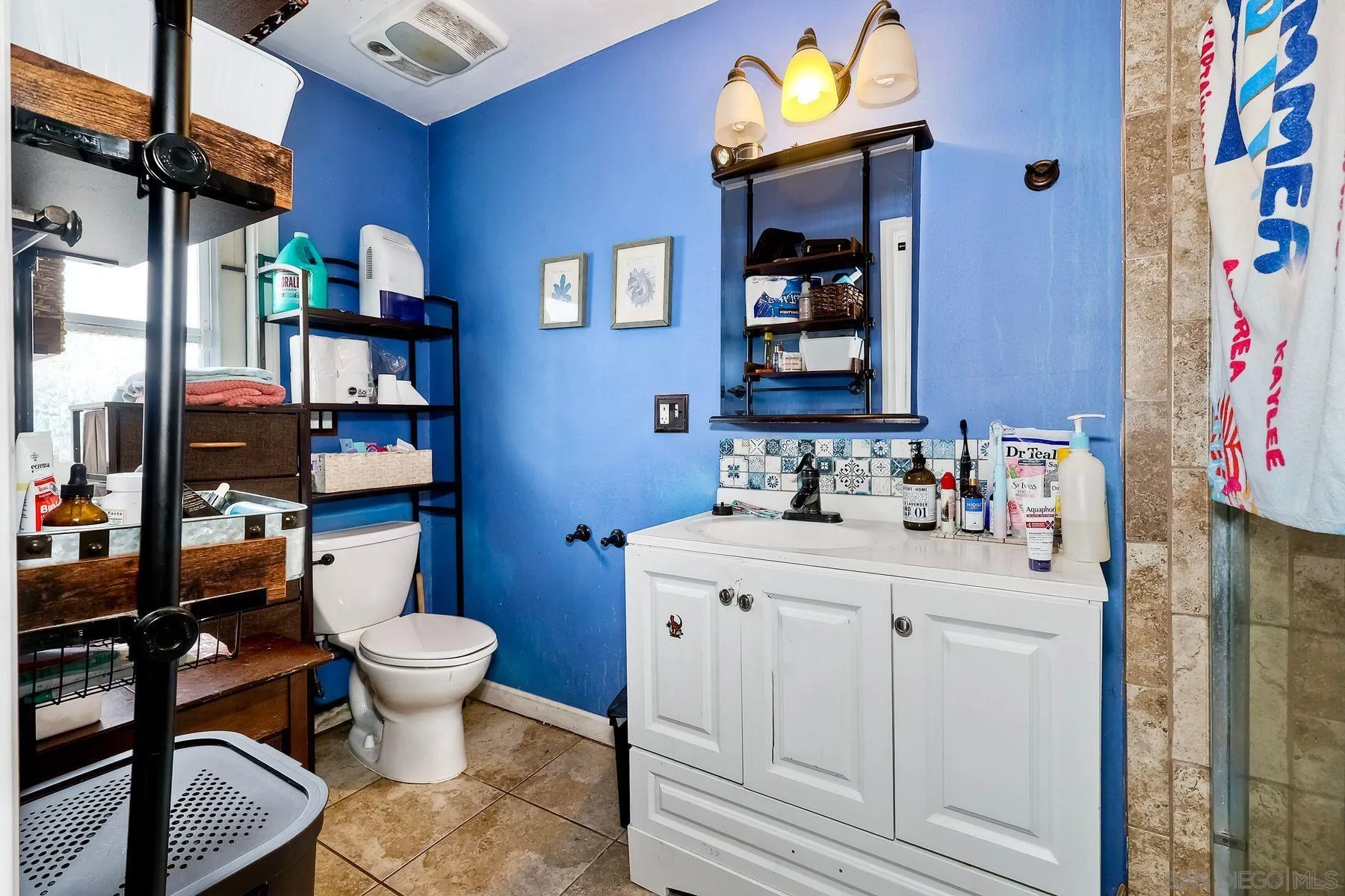 9428 Prospect Avenue Santee, CA 92071 - Photo 14 of 23 a room with stainless steel appliances a rug and a lamp