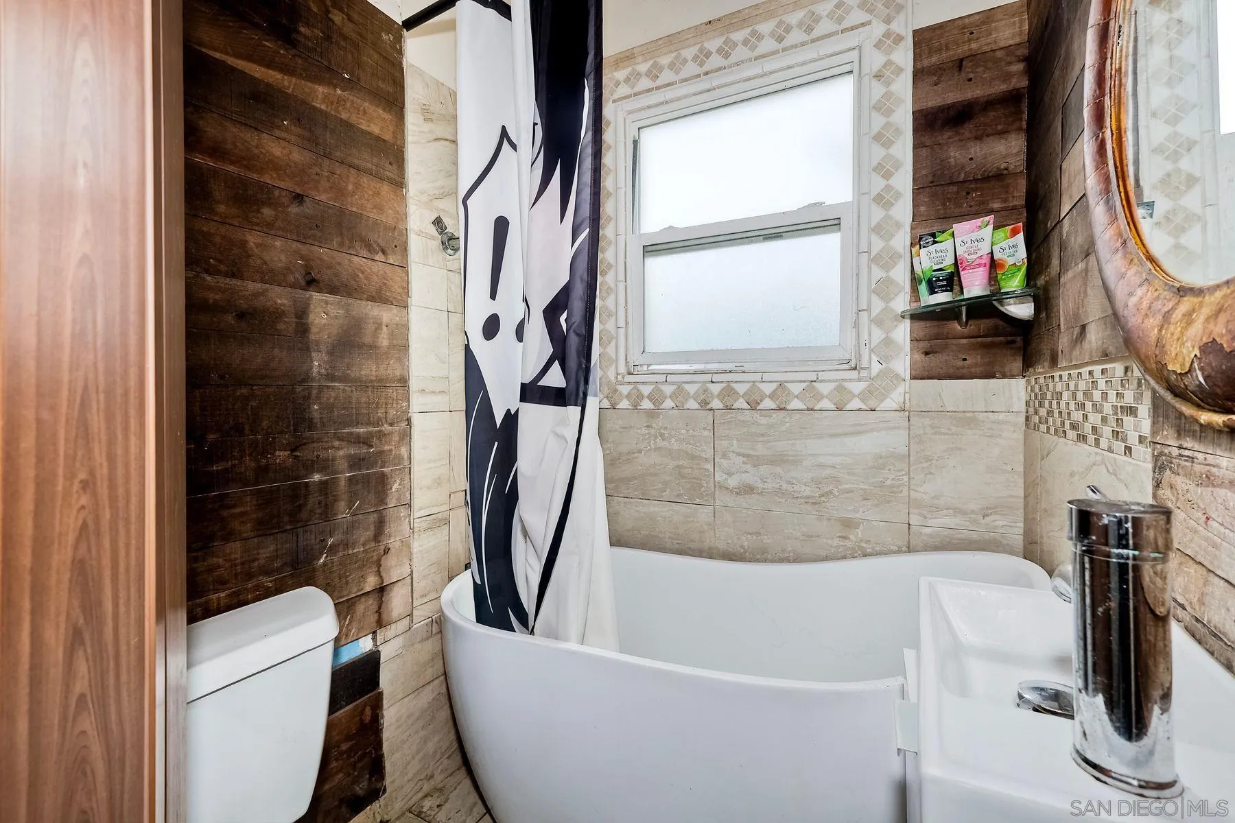 9428 Prospect Avenue Santee, CA 92071 - Photo 17 of 23 a bathroom with a sink a toilet a window and a shower