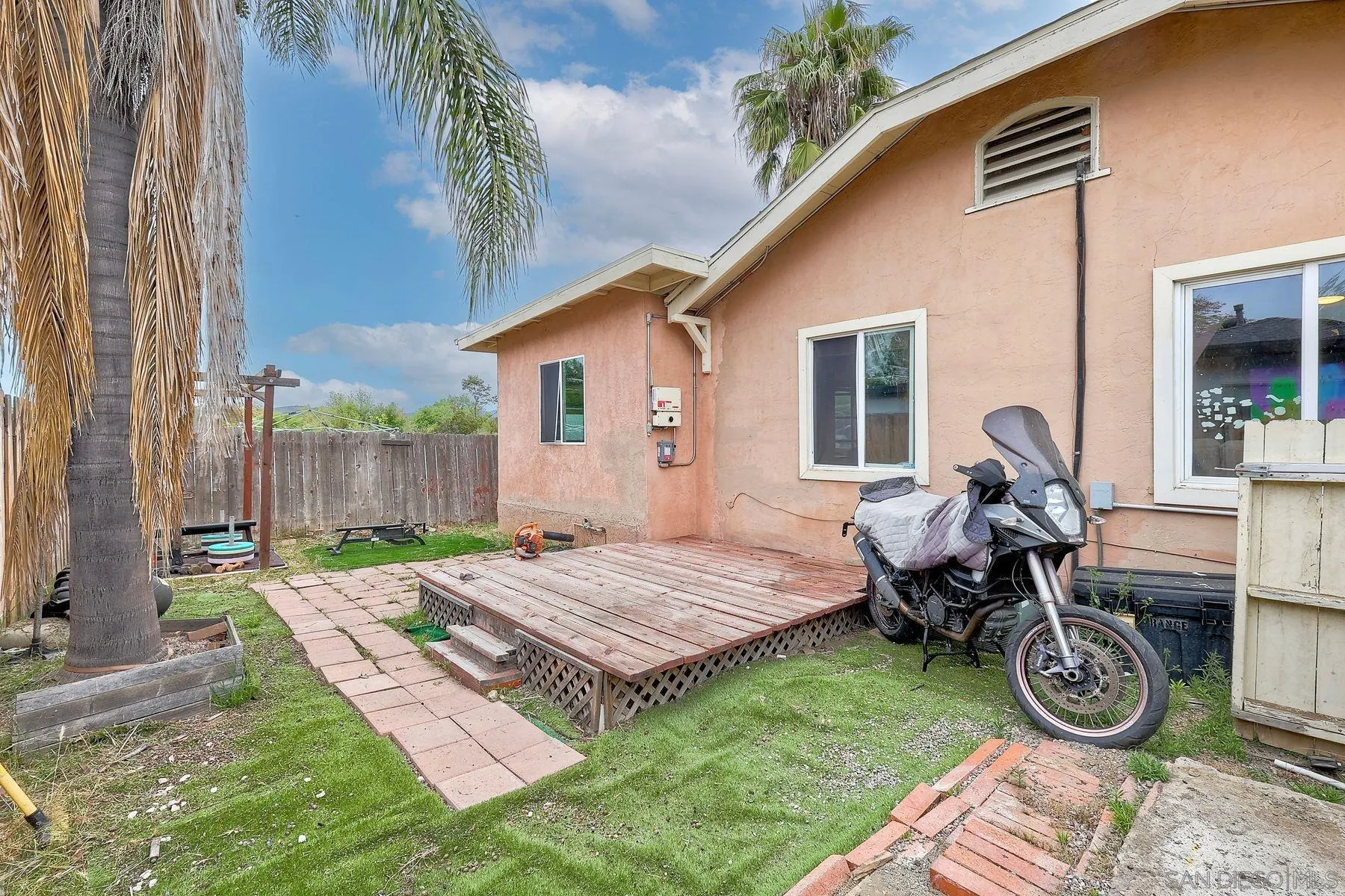 9428 Prospect Avenue Santee, CA 92071 - Photo 20 of 23 a view of a house with small yard and wooden fence