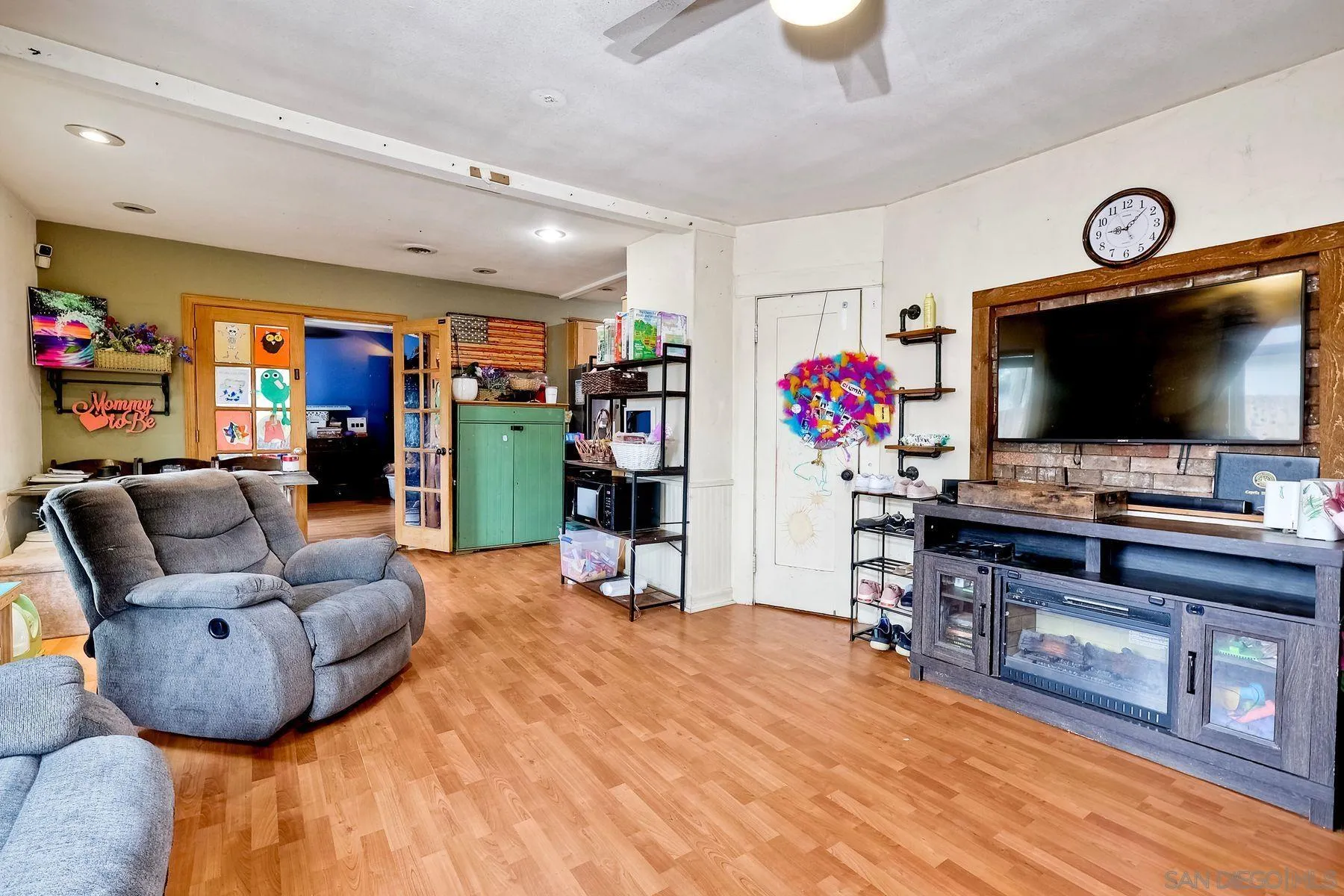 9428 Prospect Avenue Santee, CA 92071 - Photo 4 of 23 a living room with furniture and a flat screen tv