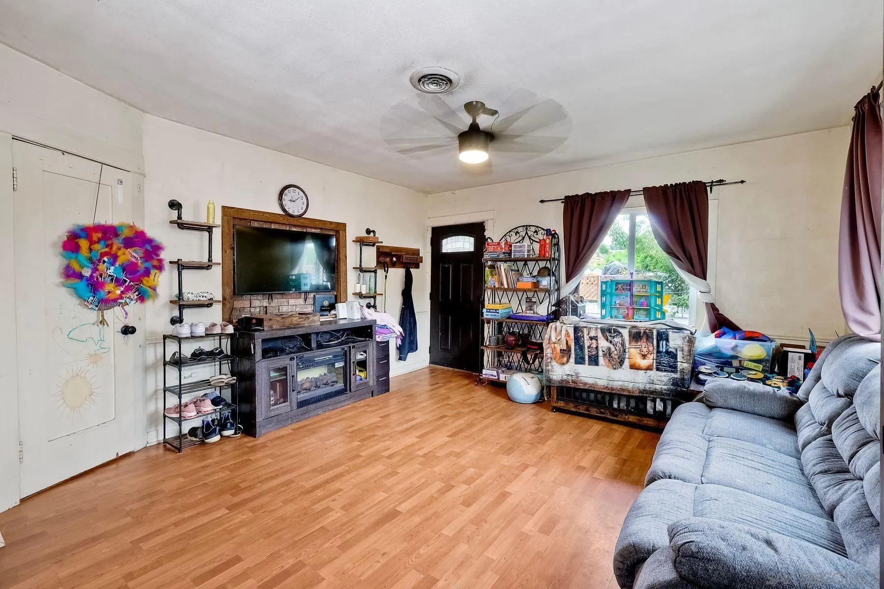 9428 Prospect Avenue Santee, CA 92071 - Photo 5 of 23 a living room with furniture and a flat screen tv