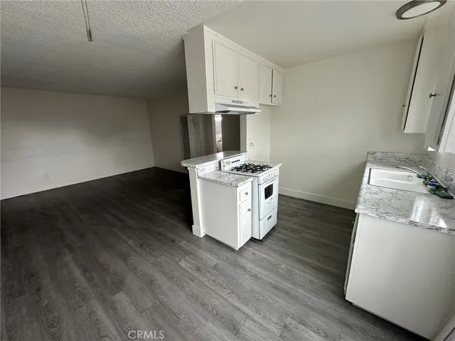 a kitchen with a stove and a microwave