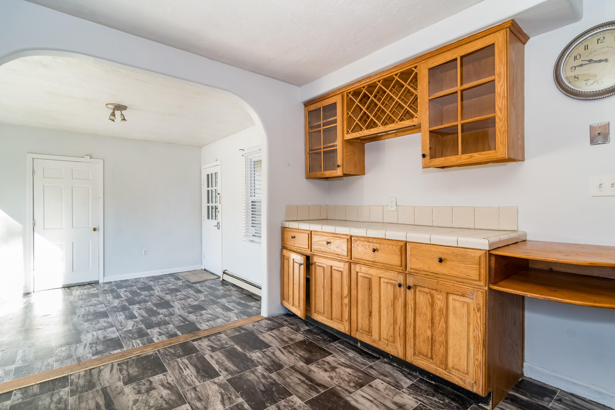 62 Windsor Road Sandwich, MA 02563 - Photo 11 of 24 a hallway with a sink a cabinets and a window