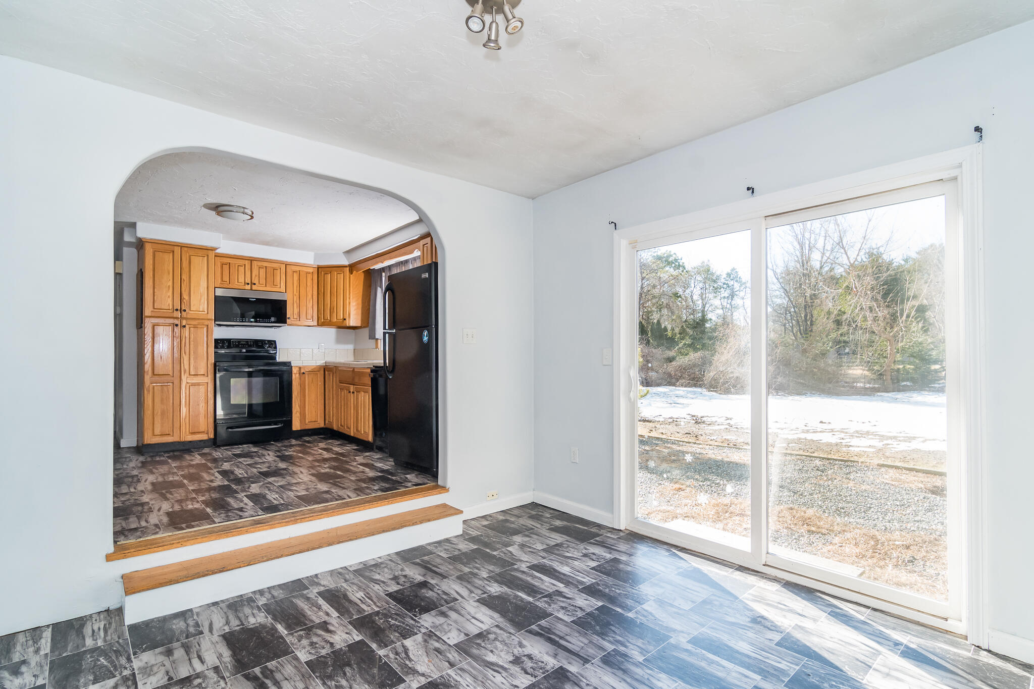 62 Windsor Road Sandwich, MA 02563 - Photo 12 of 24 a living room with a rug floor and a table