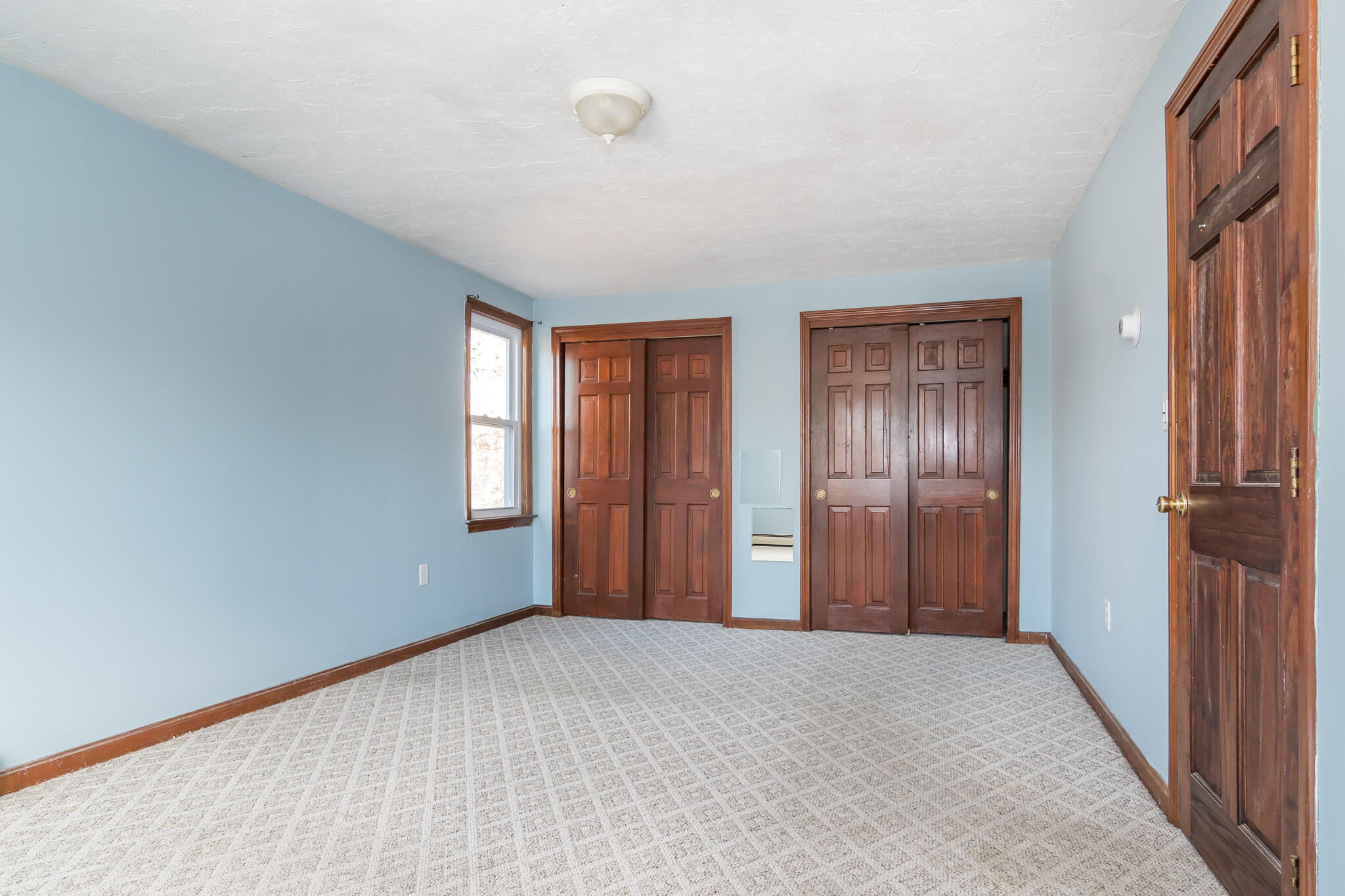 62 Windsor Road Sandwich, MA 02563 - Photo 14 of 24 a view of an empty room with windows