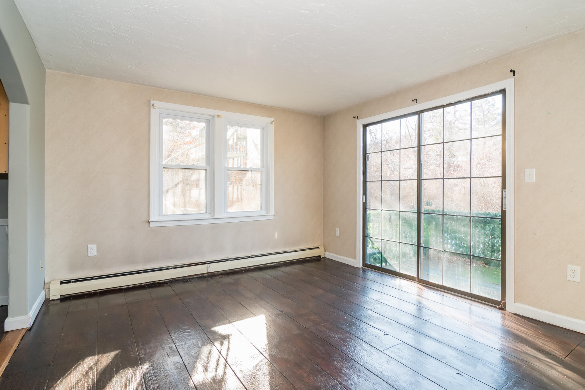 62 Windsor Road Sandwich, MA 02563 - Photo 7 of 24 wooden floor in an empty room with a window