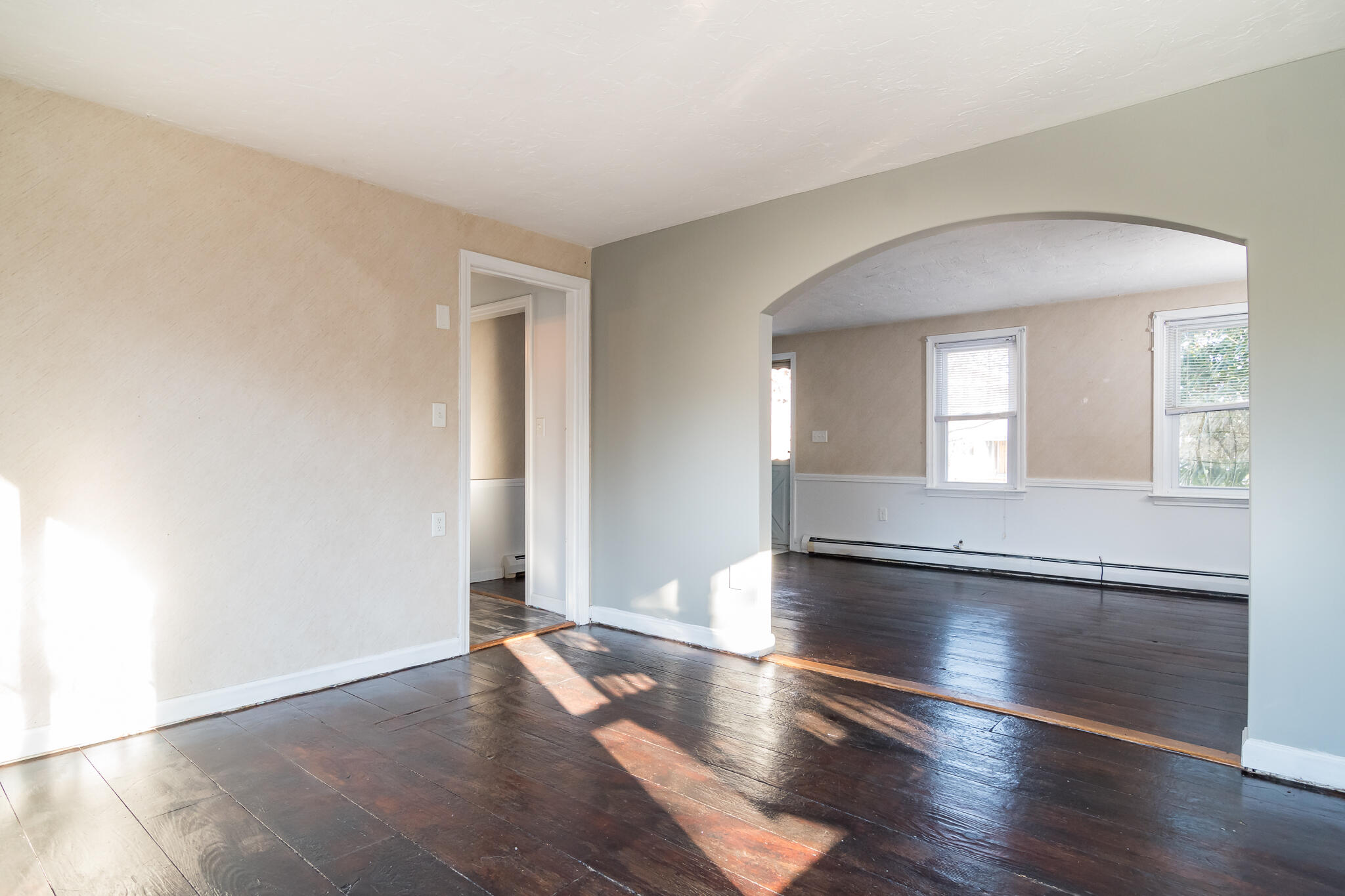 62 Windsor Road Sandwich, MA 02563 - Photo 8 of 24 an empty room with wooden floor and windows