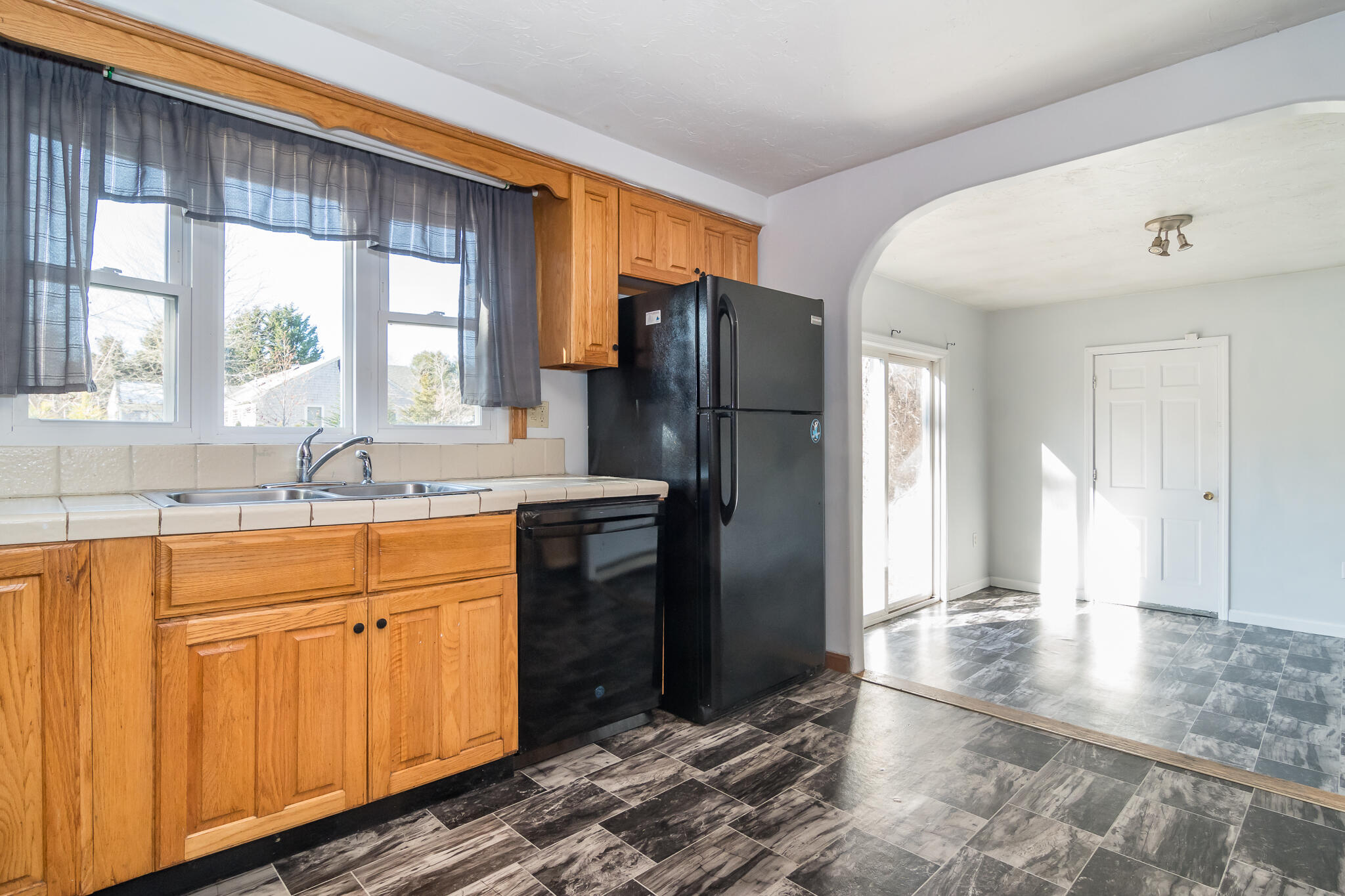62 Windsor Road Sandwich, MA 02563 - Photo 10 of 24 a kitchen with stainless steel appliances granite countertop a refrigerator and a sink