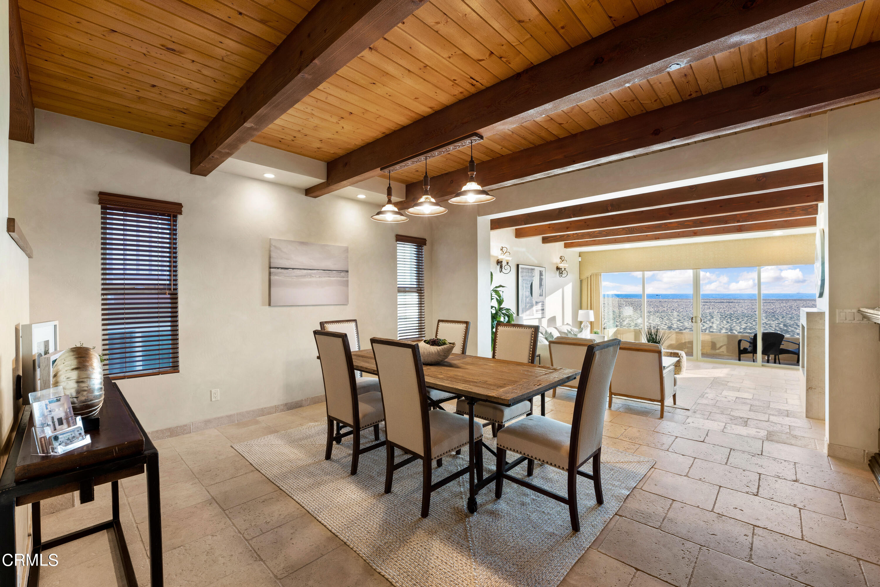 209 Ocean Drive Oxnard, CA 93035 - Photo 16 of 49 a dining room with furniture and a floor to ceiling window