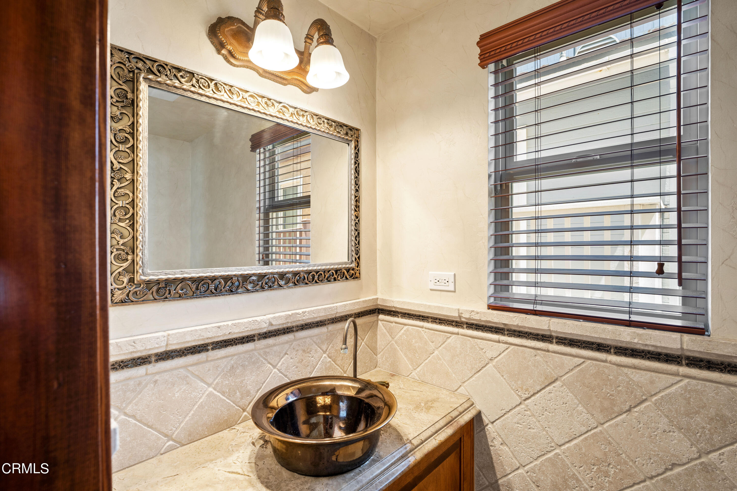 209 Ocean Drive Oxnard, CA 93035 - Photo 27 of 49 a bathroom with a sink and a mirror