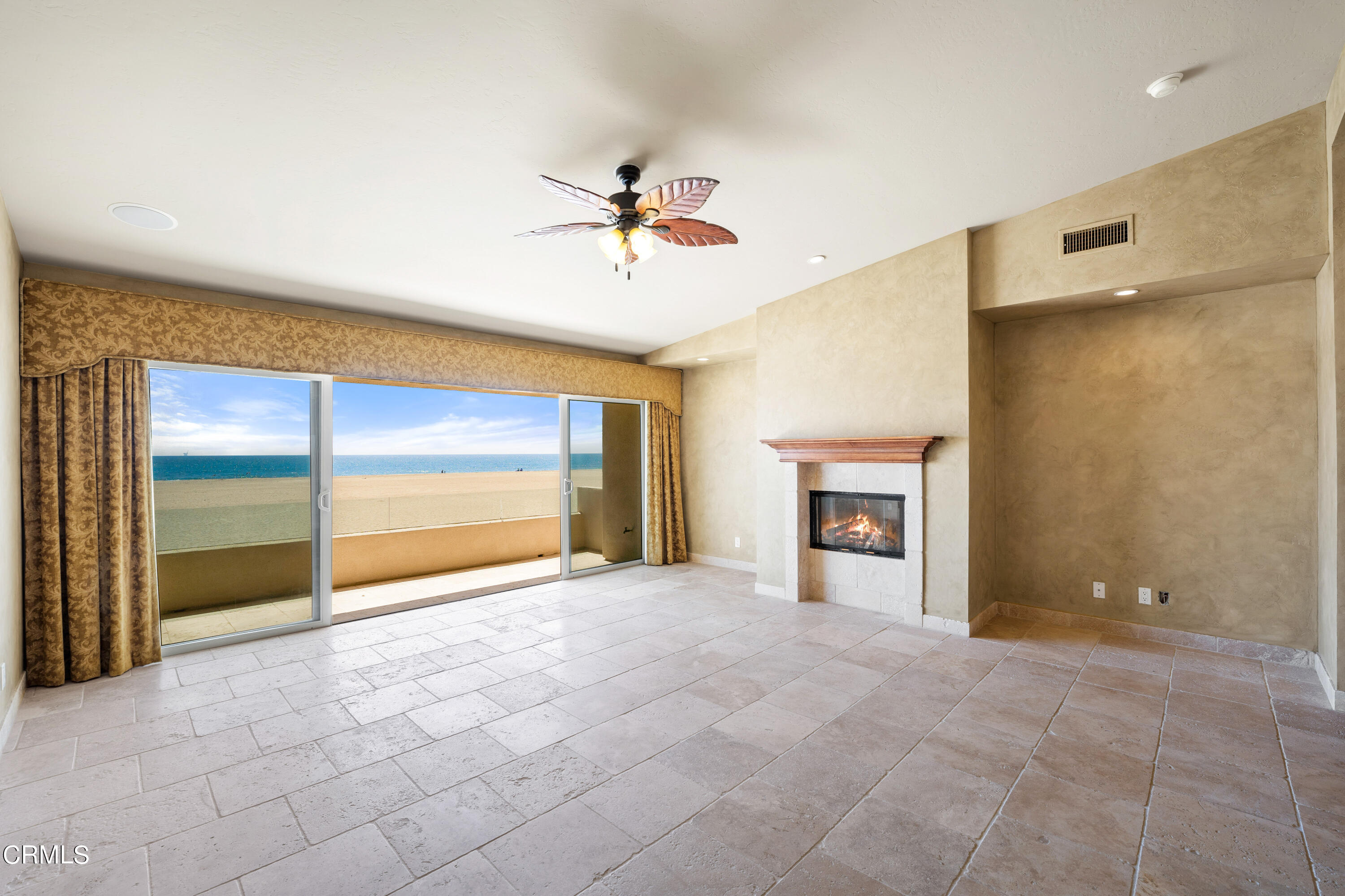 209 Ocean Drive Oxnard, CA 93035 - Photo 28 of 49 an empty room with fireplace and fan