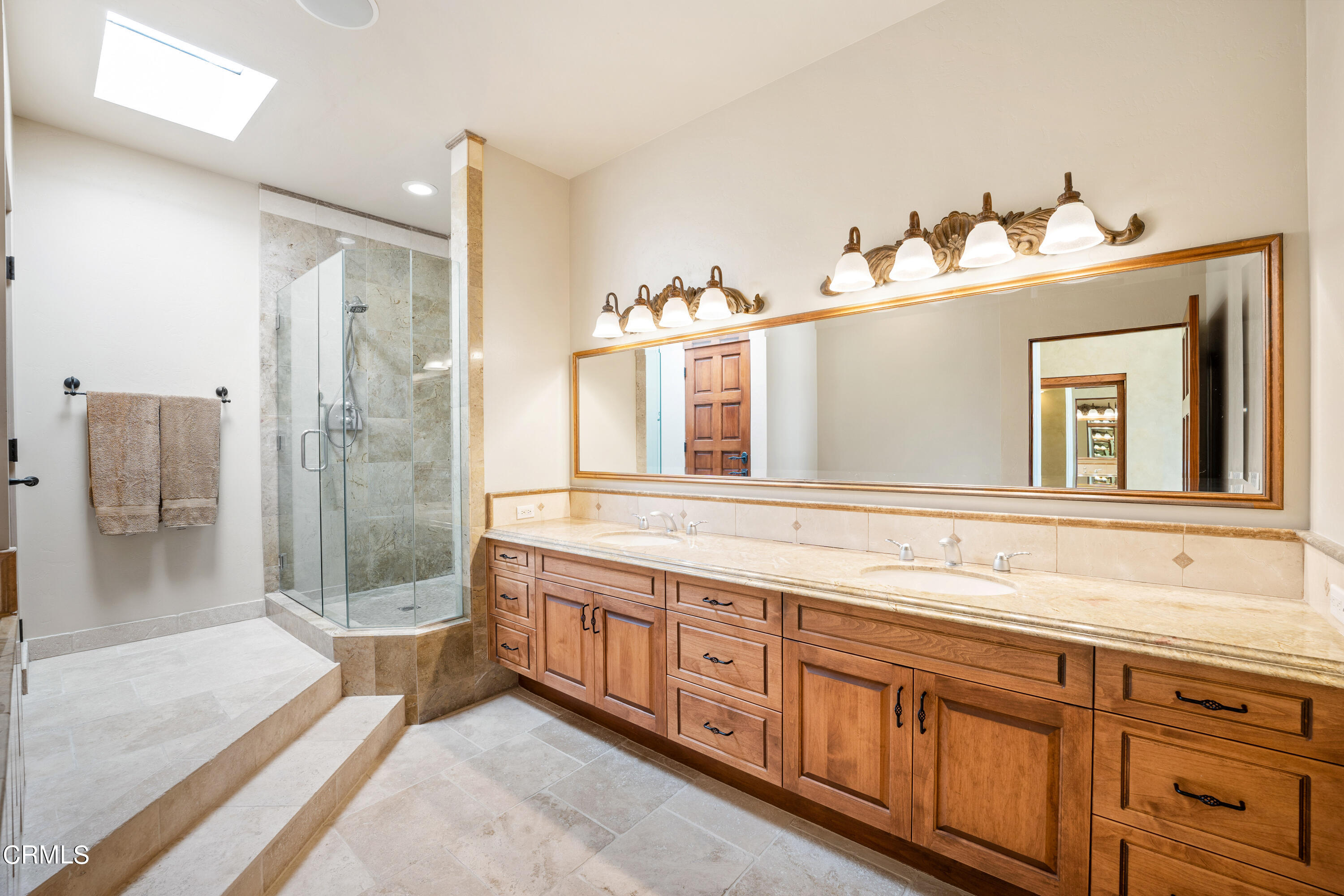209 Ocean Drive Oxnard, CA 93035 - Photo 33 of 49 a bathroom with a sink and a mirror