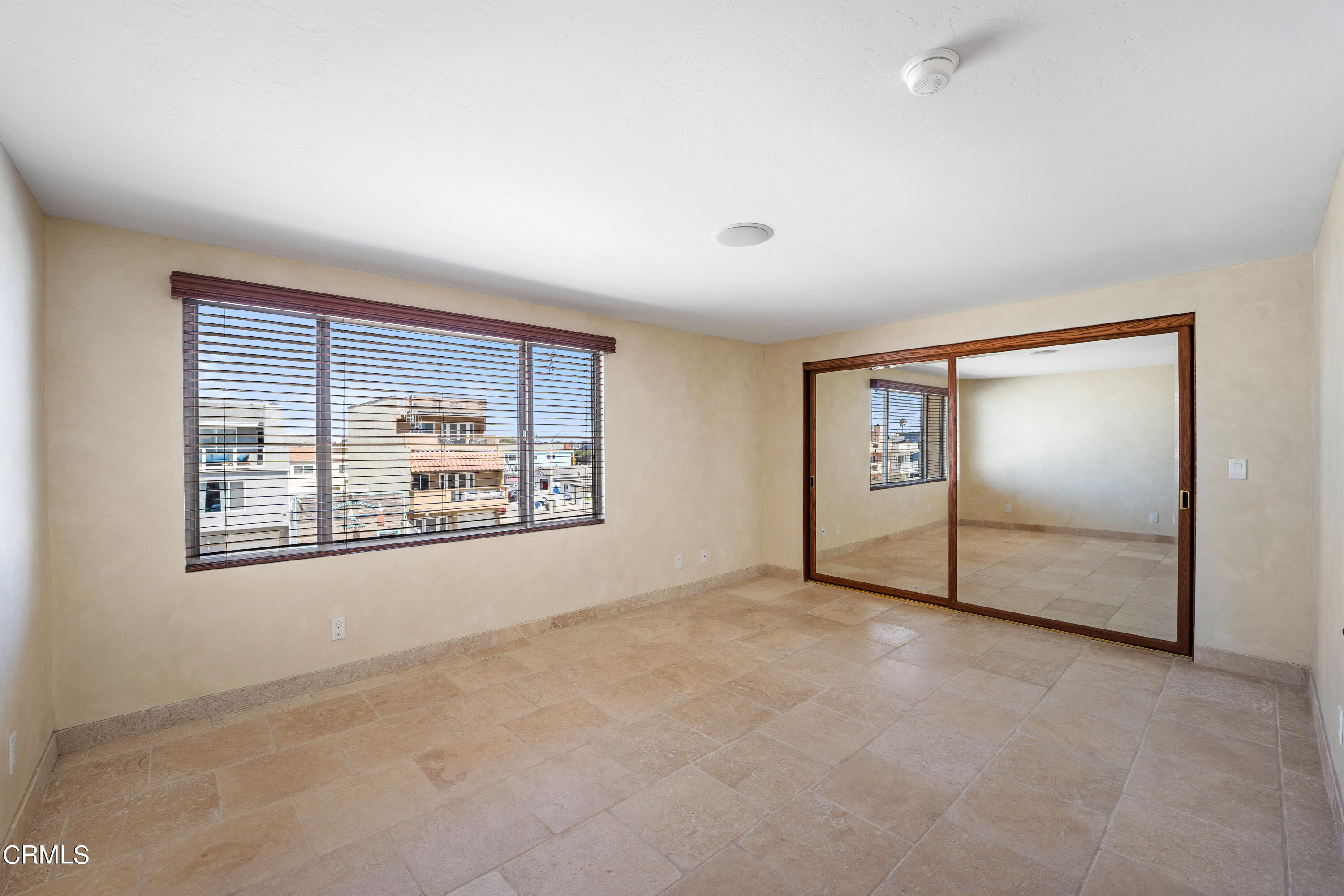 209 Ocean Drive Oxnard, CA 93035 - Photo 38 of 49 an empty room with windows and closet